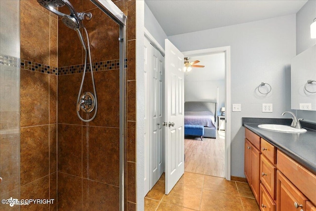 9701 Homestead Trl, Anchorage, AK 99507 - ensuite bathroom with a shower stall, vanity, ceiling fan, and tile patterned flooring