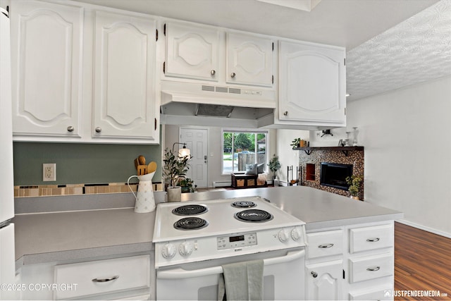 11730 Nix Ct, Anchorage, AK 99515 - kitchen with white electric range, under cabinet range hood, white cabinets, and a textured ceiling