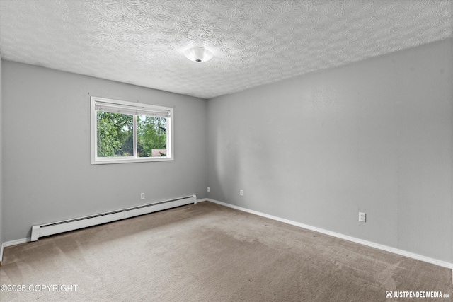 11730 Nix Ct, Anchorage, AK 99515 - empty room with a baseboard heating unit, carpet floors, a textured ceiling, and baseboards