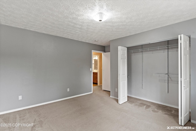 11730 Nix Ct, Anchorage, AK 99515 - unfurnished bedroom featuring carpet flooring, a closet, baseboards, and a textured ceiling