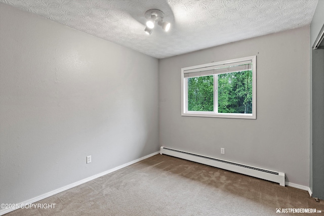 11730 Nix Ct, Anchorage, AK 99515 - carpeted empty room featuring a baseboard heating unit and baseboards