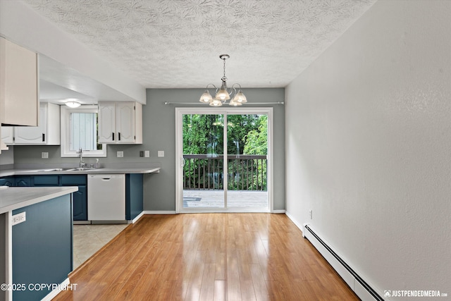 11730 Nix Ct, Anchorage, AK 99515 - kitchen featuring white dishwasher, white cabinetry, a chandelier, a baseboard radiator, and light countertops