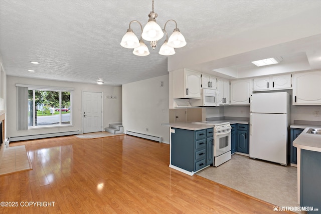 11730 Nix Ct, Anchorage, AK 99515 - kitchen featuring white appliances, baseboard heating, a chandelier, light countertops, and a textured ceiling