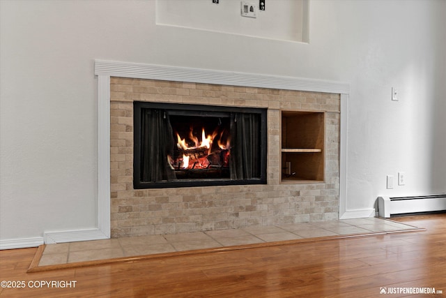 11730 Nix Ct, Anchorage, AK 99515 - detailed view of a baseboard radiator, wood finished floors, and baseboards