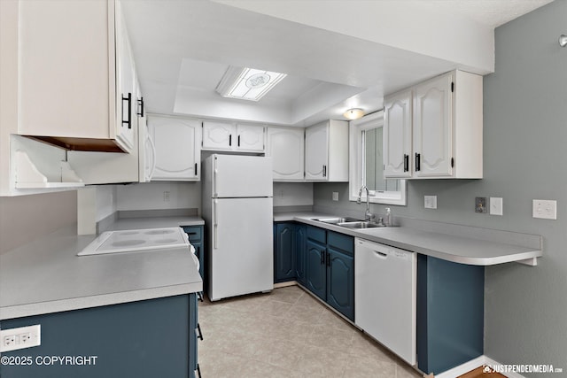 11730 Nix Ct, Anchorage, AK 99515 - kitchen with white appliances, a sink, blue cabinets, and light countertops