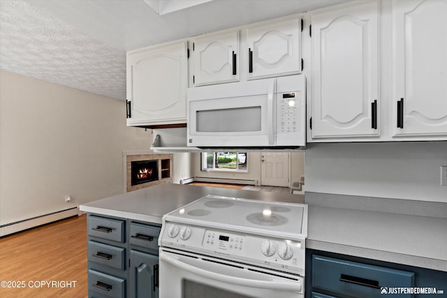 11730 Nix Ct, Anchorage, AK 99515 - kitchen with white appliances, white cabinets, a textured ceiling, light wood finished floors, and light countertops
