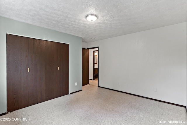 11730 Nix Ct, Anchorage, AK 99515 - unfurnished bedroom with a closet, baseboards, and a textured ceiling