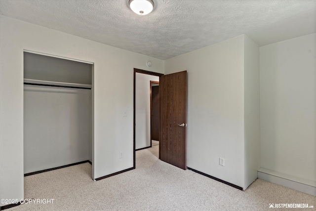 11730 Nix Ct, Anchorage, AK 99515 - unfurnished bedroom featuring a closet, baseboards, a textured ceiling, and carpet