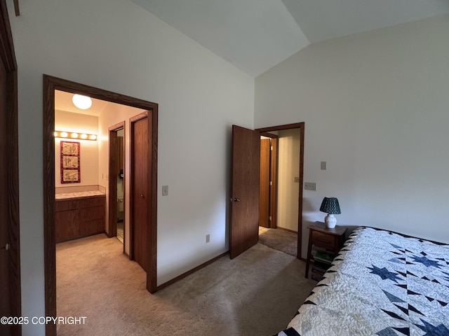 34008 Orlander Ave, Seward, AK 99664 - bedroom with light carpet, high vaulted ceiling, and ensuite bath
