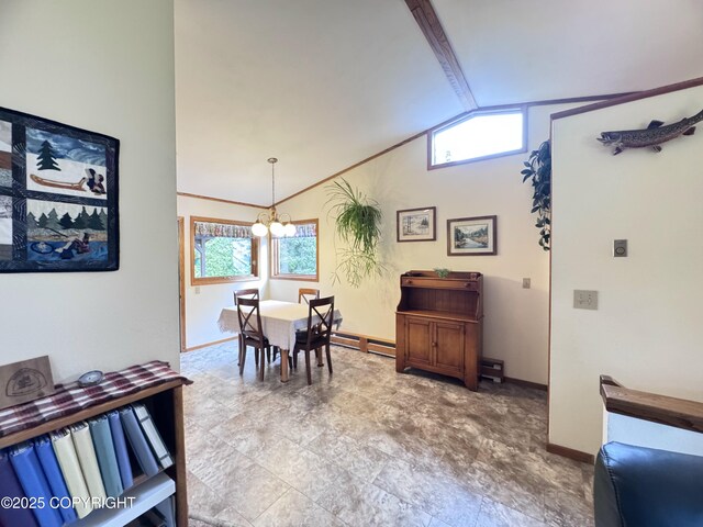34008 Orlander Ave, Seward, AK 99664 - dining room with lofted ceiling, a chandelier, and baseboards