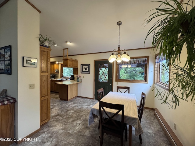 34008 Orlander Ave, Seward, AK 99664 - dining area with baseboards, a chandelier, and crown molding
