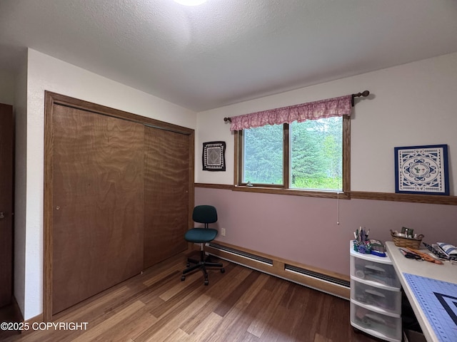 34008 Orlander Ave, Seward, AK 99664 - office space with a baseboard heating unit and light wood-style flooring