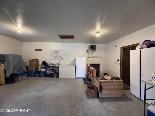 34008 Orlander Ave, Seward, AK 99664 - garage with refrigerator, freestanding refrigerator, and a heating unit