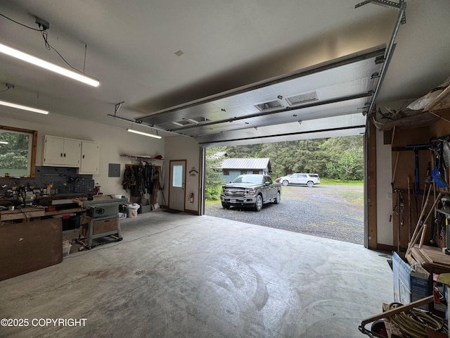 34008 Orlander Ave, Seward, AK 99664 - garage featuring a workshop area and electric panel