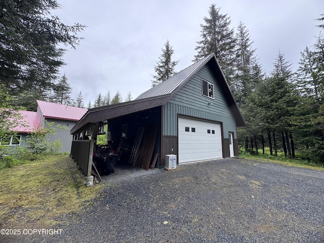 34008 Orlander Ave, Seward, AK 99664 - garage featuring a detached garage and gravel driveway