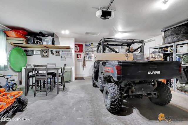 962 S Rebecca Dr, Palmer, AK 99645 - garage featuring a garage door opener