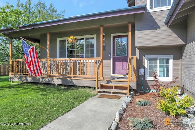 962 S Rebecca Dr, Palmer, AK 99645 - doorway to property featuring covered porch and a yard