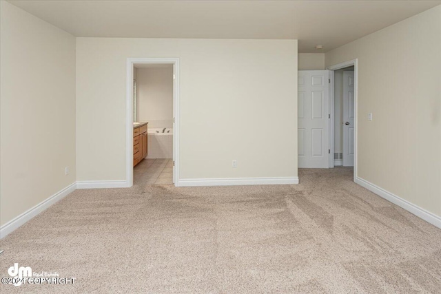 17231 Alice Loop, Eagle River, AK 99577 - unfurnished bedroom featuring light carpet and ensuite bathroom