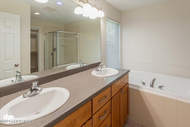 17231 Alice Loop, Eagle River, AK 99577 - full bathroom featuring a shower stall, double vanity, a bath, and a spacious closet