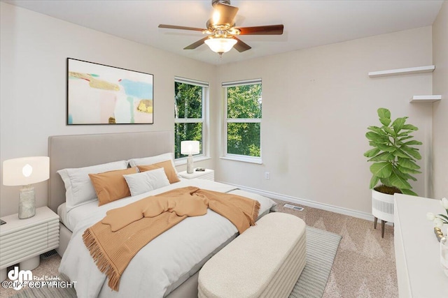 17231 Alice Loop, Eagle River, AK 99577 - carpeted bedroom with baseboards and a ceiling fan