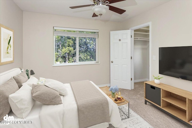 17231 Alice Loop, Eagle River, AK 99577 - bedroom featuring light colored carpet, a ceiling fan, and a walk in closet