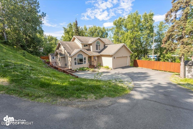 17231 Alice Loop, Eagle River, AK 99577 - view of front of house featuring driveway and an attached garage
