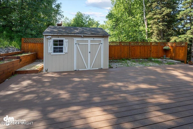 17231 Alice Loop, Eagle River, AK 99577 - deck with a fenced backyard and a storage shed