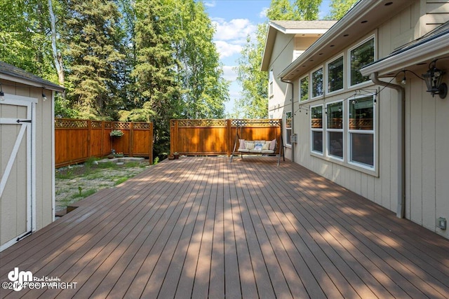 17231 Alice Loop, Eagle River, AK 99577 - wooden deck featuring a fenced backyard and outdoor lounge area