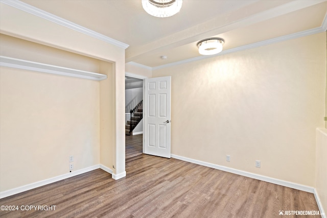 19237 Beverly Ave, Chugiak, AK 99567 - unfurnished bedroom featuring wood finished floors and ornamental molding