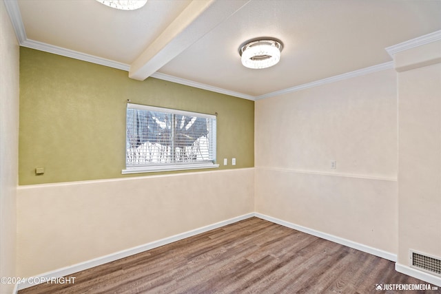 19237 Beverly Ave, Chugiak, AK 99567 - spare room featuring wood finished floors, crown molding, and beamed ceiling