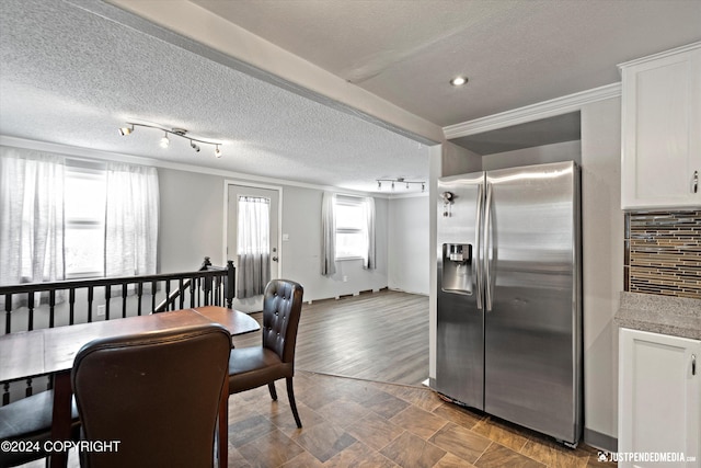 19237 Beverly Ave, Chugiak, AK 99567 - dining room with a textured ceiling, ornamental molding, and rail lighting