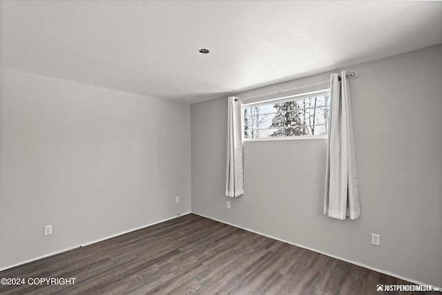 19237 Beverly Ave, Chugiak, AK 99567 - empty room with dark wood finished floors