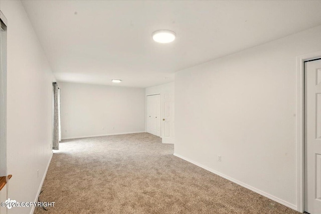 10270 Sextant Cir, Anchorage, AK 99515 - spare room featuring carpet flooring and baseboards
