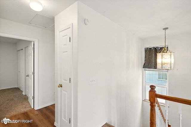10270 Sextant Cir, Anchorage, AK 99515 - hallway with an upstairs landing, attic access, wood finished floors, and baseboards