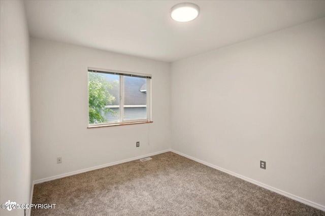 10270 Sextant Cir, Anchorage, AK 99515 - carpeted spare room featuring baseboards