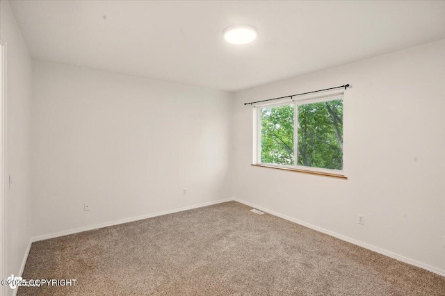 10270 Sextant Cir, Anchorage, AK 99515 - unfurnished room with carpet floors and baseboards