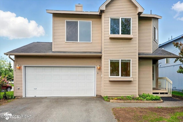 10270 Sextant Cir, Anchorage, AK 99515 - view of front of home with driveway, a chimney, an attached garage, and roof with shingles