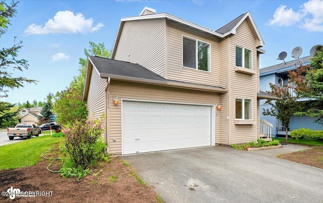 10270 Sextant Cir, Anchorage, AK 99515 - view of front of home featuring a garage and asphalt driveway
