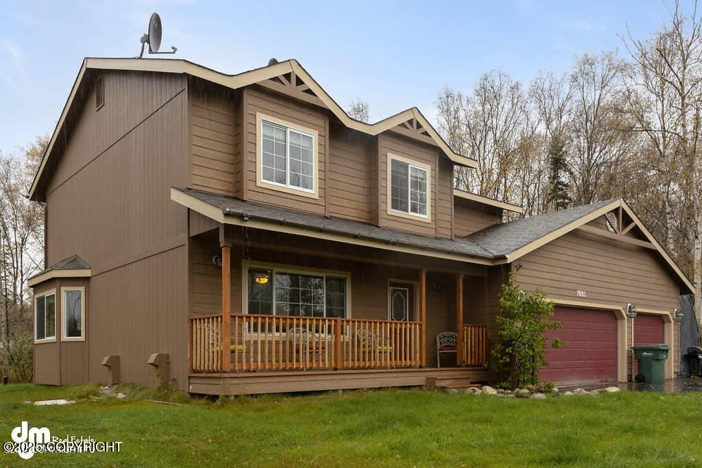 7693 E Aspen Ridge Rd, Wasilla, AK 99654 - view of front of house featuring covered porch, a front lawn, an attached garage, and roof with shingles
