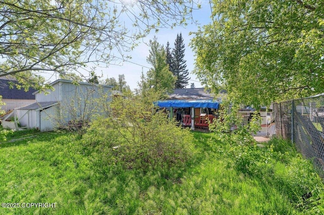 1507 Elmendorf Dr, Anchorage, AK 99504 - view of yard featuring a wooden deck