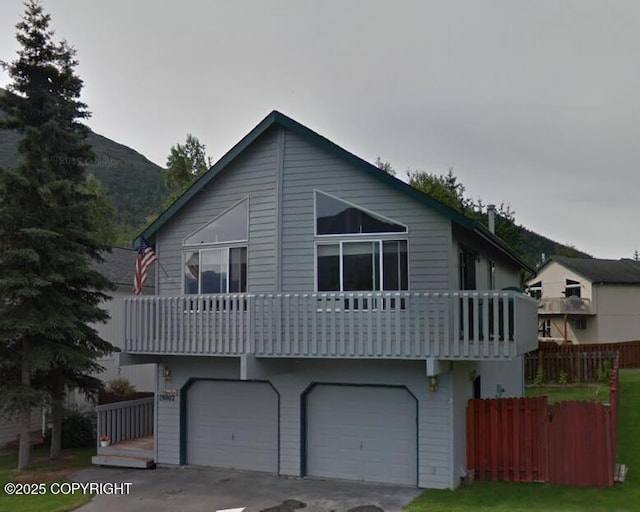 19002 Mountain Point Cir, Eagle River, AK 99577 - view of front of house with a garage, a balcony, and concrete driveway