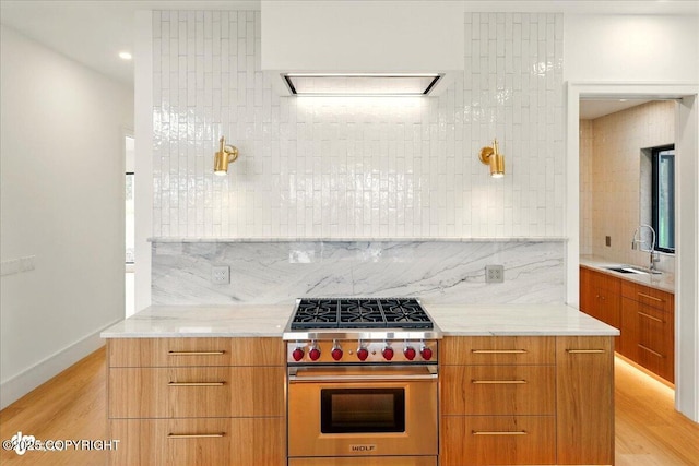 1308 Cunningham Ct, Kenai, AK 99611 - kitchen featuring modern cabinets, designer range, a sink, and brown cabinets