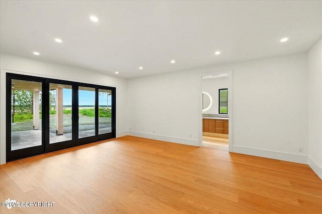 1308 Cunningham Ct, Kenai, AK 99611 - spare room featuring recessed lighting, light wood-type flooring, and baseboards