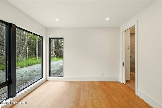 1308 Cunningham Ct, Kenai, AK 99611 - empty room with light wood-type flooring, baseboards, and recessed lighting