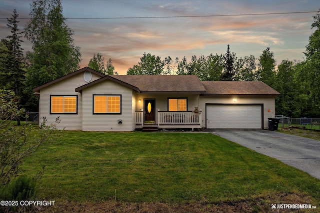 4470 E Birchwood Dr, Wasilla, AK 99654 - ranch-style home with asphalt driveway, an attached garage, a porch, and a shingled roof