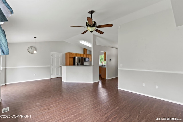 4470 E Birchwood Dr, Wasilla, AK 99654 - unfurnished living room with ceiling fan, dark wood-type flooring, vaulted ceiling, and baseboards