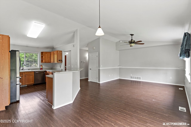4470 E Birchwood Dr, Wasilla, AK 99654 - kitchen featuring appliances with stainless steel finishes, dark wood-style floors, ceiling fan, light countertops, and vaulted ceiling