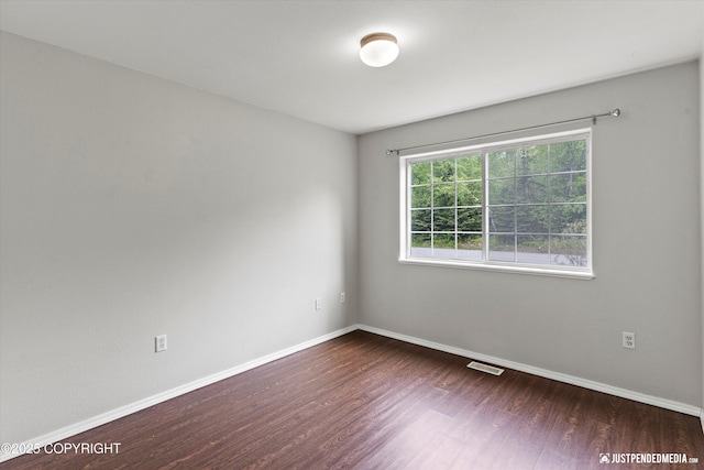 4470 E Birchwood Dr, Wasilla, AK 99654 - spare room with wood finished floors and baseboards