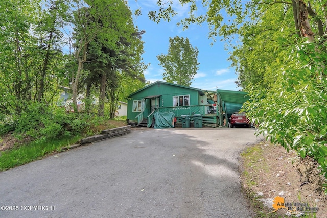 7510 Peck Ave, Anchorage, AK 99504 - view of front of property with driveway and a carport