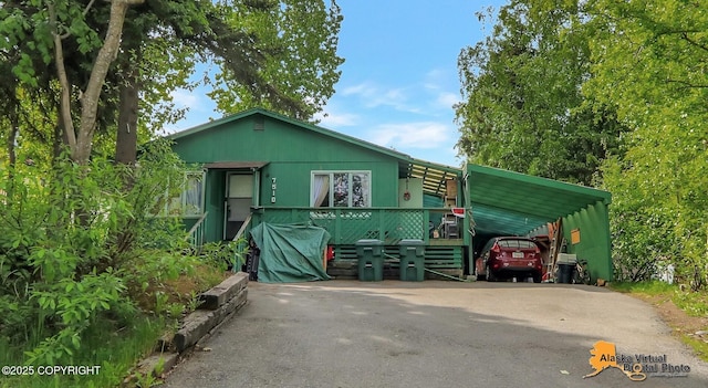 7510 Peck Ave, Anchorage, AK 99504 - view of front of property with driveway and a carport